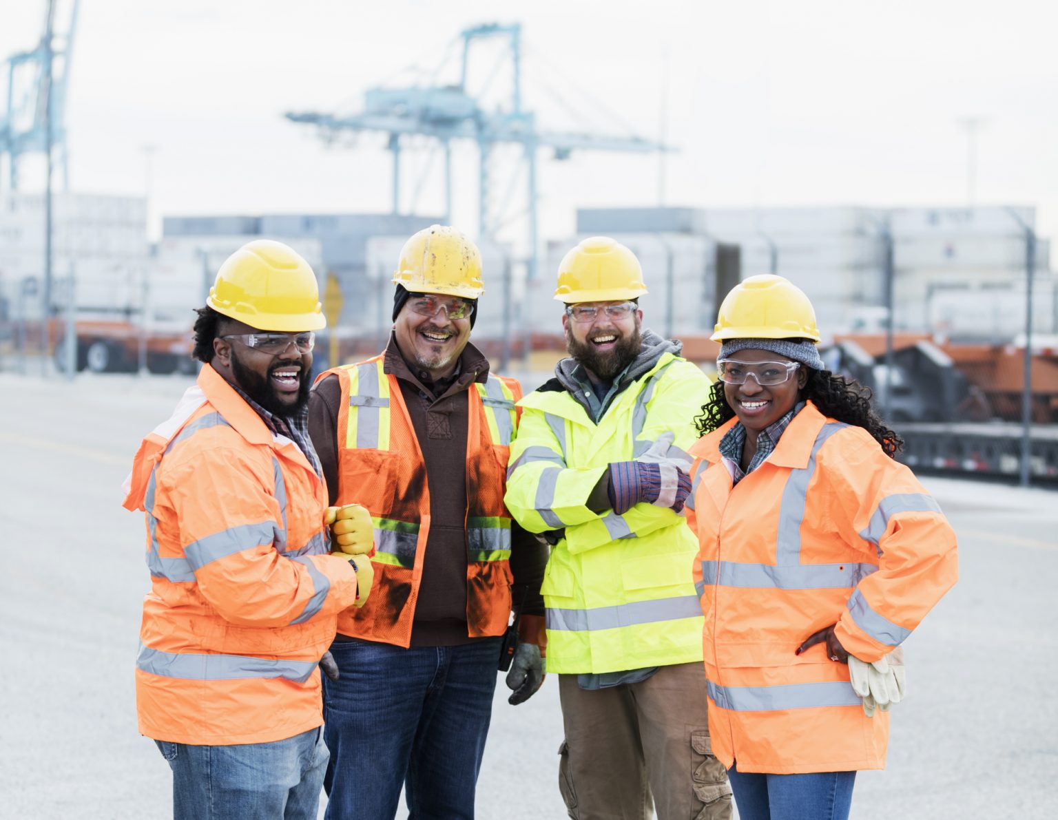 Multi-ethnic dock workers at shipping port - Subcontractors USA